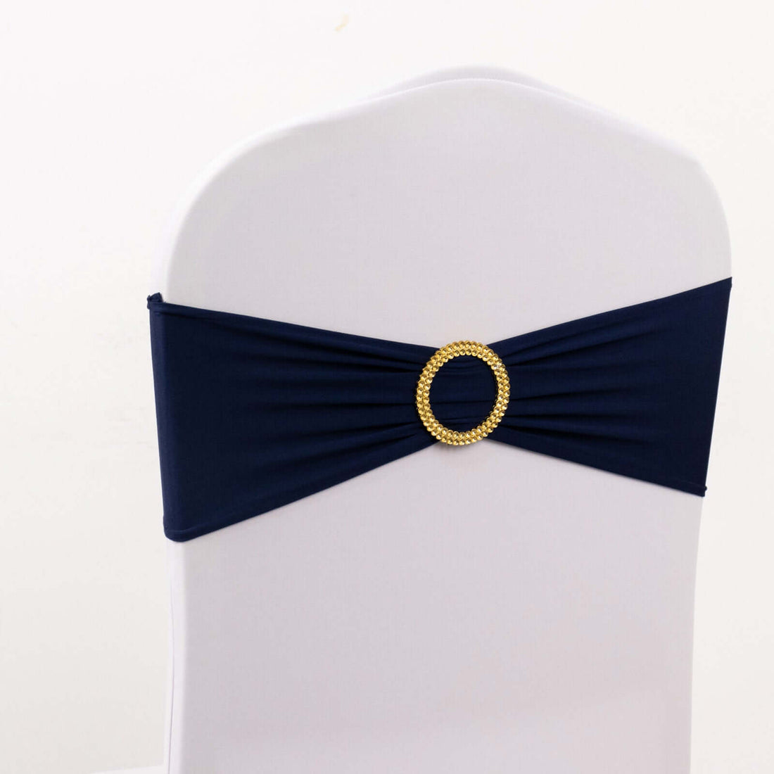 Navy blue chair cover with a gold decorative buckle