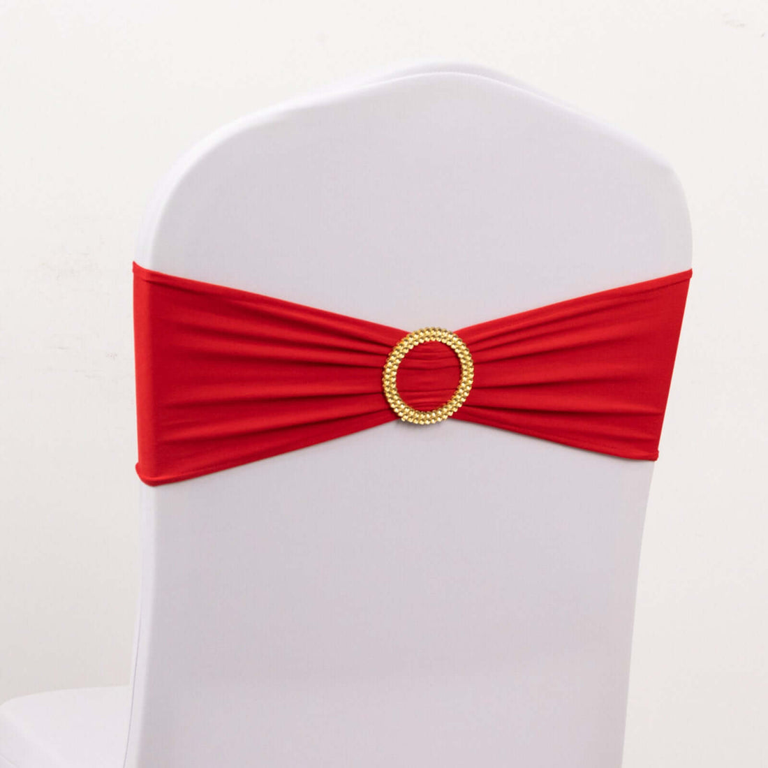 Red chair cover with gold accent for weddings and events