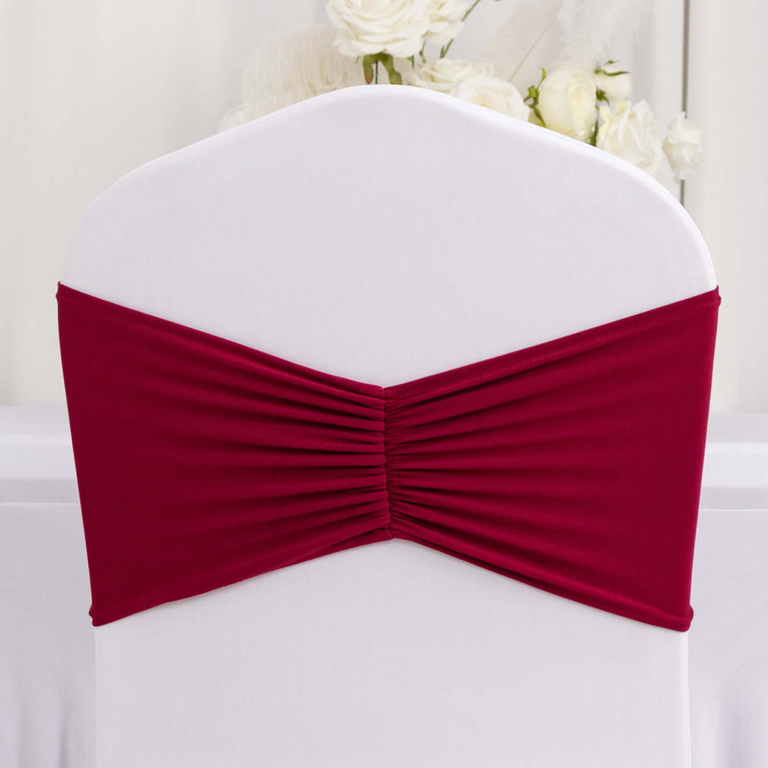 Burgundy pleated chair cover for elegant event decor
