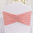 Pink chair cover with pleated design for elegant event decor.