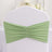 Green chair cover with gathered fabric detail.