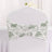 Floral chair cover with gathered design for elegant event decor.