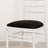 White chiavari chair with a black cushion seat.