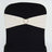 Ivory satin chair sash with heart-shaped embellishment on black chair