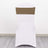 White chair with a brown sash on a plain backdrop