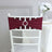 Burgundy chair sash with rhinestone buckle on a white chair