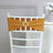 Mustard chair sash with rhinestone accent on a white chiavari chair.