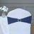 Navy chair cover with decorative buckle for elegant event decor.