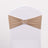 Beige chair sash with rhinestone buckle on white chair