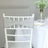 Elegant gray chair sash with rhinestone buckle on a white chiavari chair.