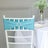 Turquoise chair sash with brooch on a white chiavari chair