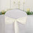 White chair cover with elegant ribbon bow, perfect for weddings and events.