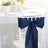 Navy blue chair sash tied elegantly on a white chiavari chair