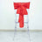 Transparent chair with a red fabric bow tied on the back.