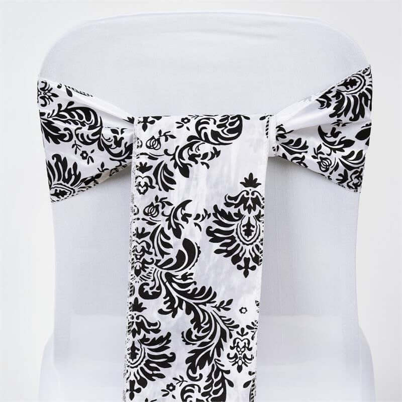 Black and white patterned chair sash on a white chair. #whtbkgd