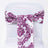 Purple floral chair sash on a white chair.