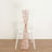 Rose gold sequin chair sash tied on a white chair.