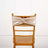 Gold satin chair sash tied at the back of a wooden chair