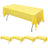 Yellow tablecloth draped over a long table in a studio setting