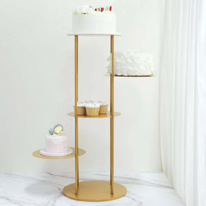 Gold dessert stand with cakes and cupcakes on a marble surface.