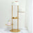 Gold dessert stand with cakes and cupcakes on a marble surface.