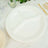 White three-compartment plate on a wooden table with decorative elements.