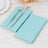 Light blue paper napkins with a silver fork and knife on a wooden table.