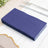 Stack of navy blue paper napkins on a table setting.