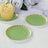 Green paper plates with gold trim, perfect for parties and events.