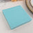 Turquoise paper napkins stacked neatly for table settings