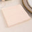 Peach-colored napkin on a neutral background