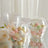 Clear plastic containers filled with colorful decorative balls.