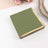 Green napkins with gold foil edges on a white background