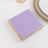 Purple napkin with gold trim on a white background.