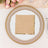 Elegant table setting with gold beaded charger and decorative napkin.