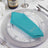 Turquoise napkin on a decorative plate for elegant dining setting.