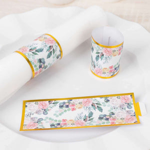 Floral-themed tableware wraps for napkins and cups on a white plate.
