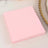 Pink napkins stacked neatly on a table.