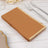 Brown paper napkins stacked on a wooden table.