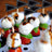 Caprese salad skewers with black triangular flags.