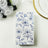 Floral-patterned napkins on a table setting with decorative elements.