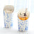 Decorative dessert cups with cream and fruit against a light background.