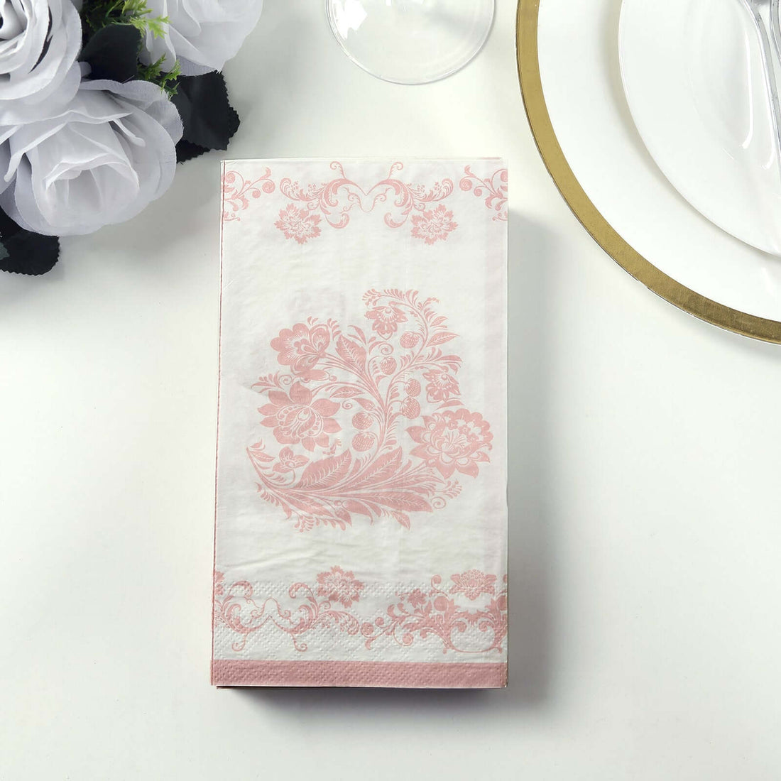 Pink floral patterned napkins on a white background.