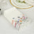 Floral printed paper napkins in a decorative box