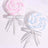 Colorful spiral lollipops wrapped in clear plastic with decorative bows.