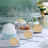 Handmade cupcakes in clear packaging with decorative toppings