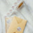 Floral thank you stickers on a roll with a postcard and envelope.