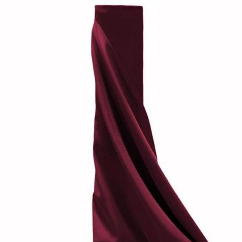 Burgundy fabric draped elegantly in a studio-style shot