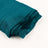 Teal crinkled fabric roll on white background