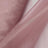 Pink satin fabric draped elegantly, showcasing its smooth texture and sheen.